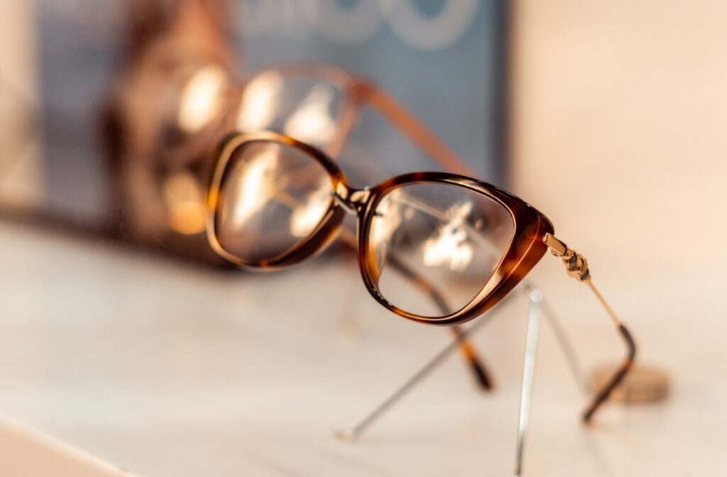 Close-up of stylish designer eyeglass frames displayed on a surface.